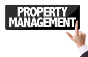 Businessman pressing button with the text: Property Management