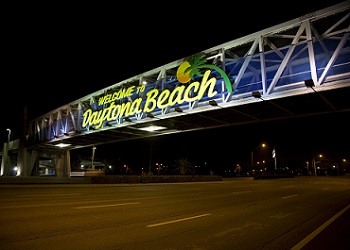 Welcome to Daytona Beach written in a foot bridge of a road, represent service area of The Realty Medics